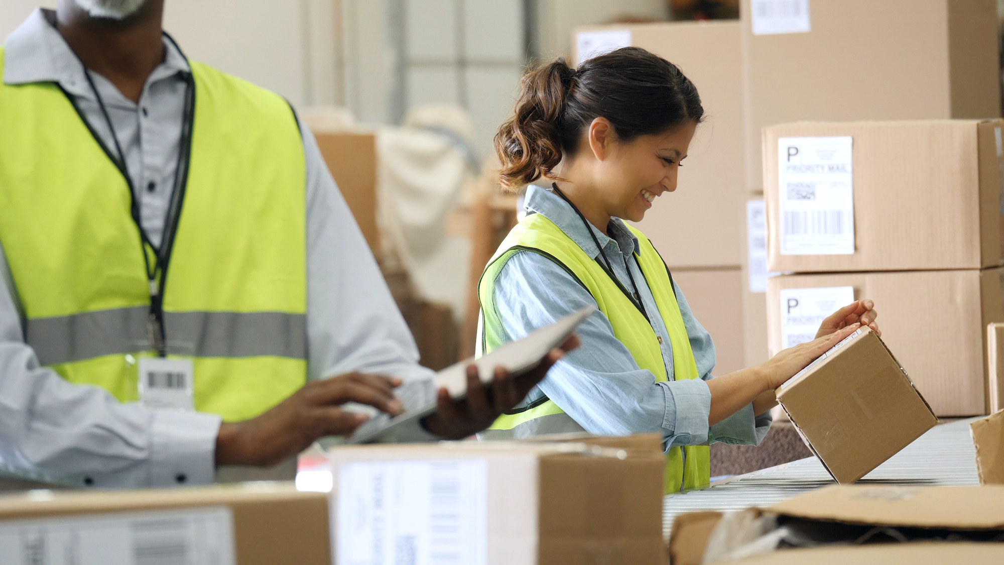 Distribution Warehouse Employees Prepare Packages For Shipment Distribution Warehouse Employees Prepare Packages For Shipment
